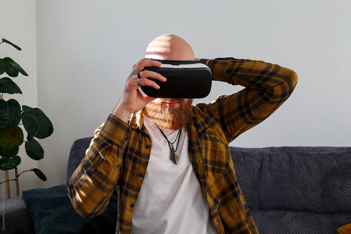 Man putting on VR goggles