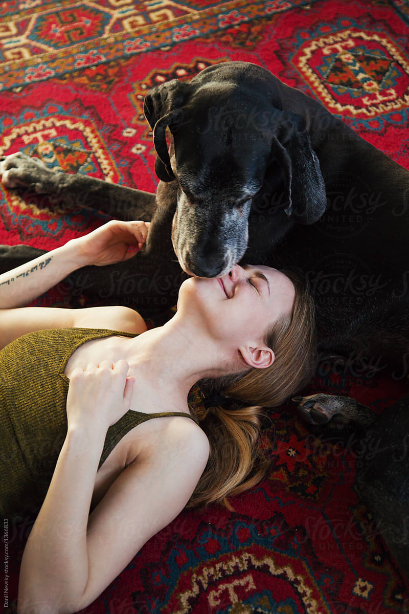 Great Dane And Girl Kissing/