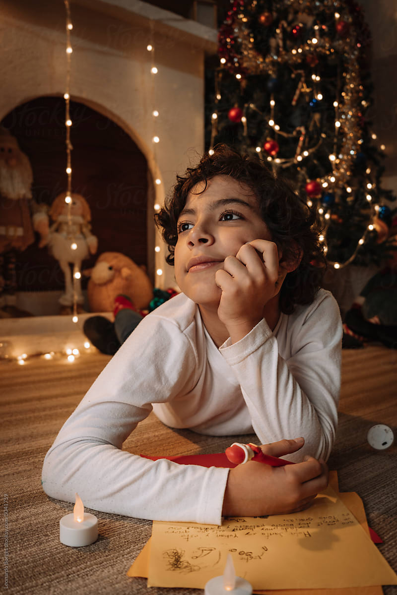 portrait of a child writing a letter to Santa Claus