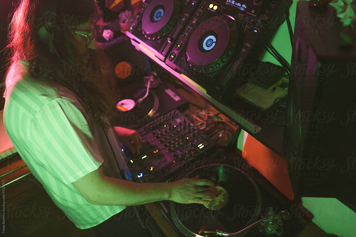 male DJ Scratching And Mixing vinyl record