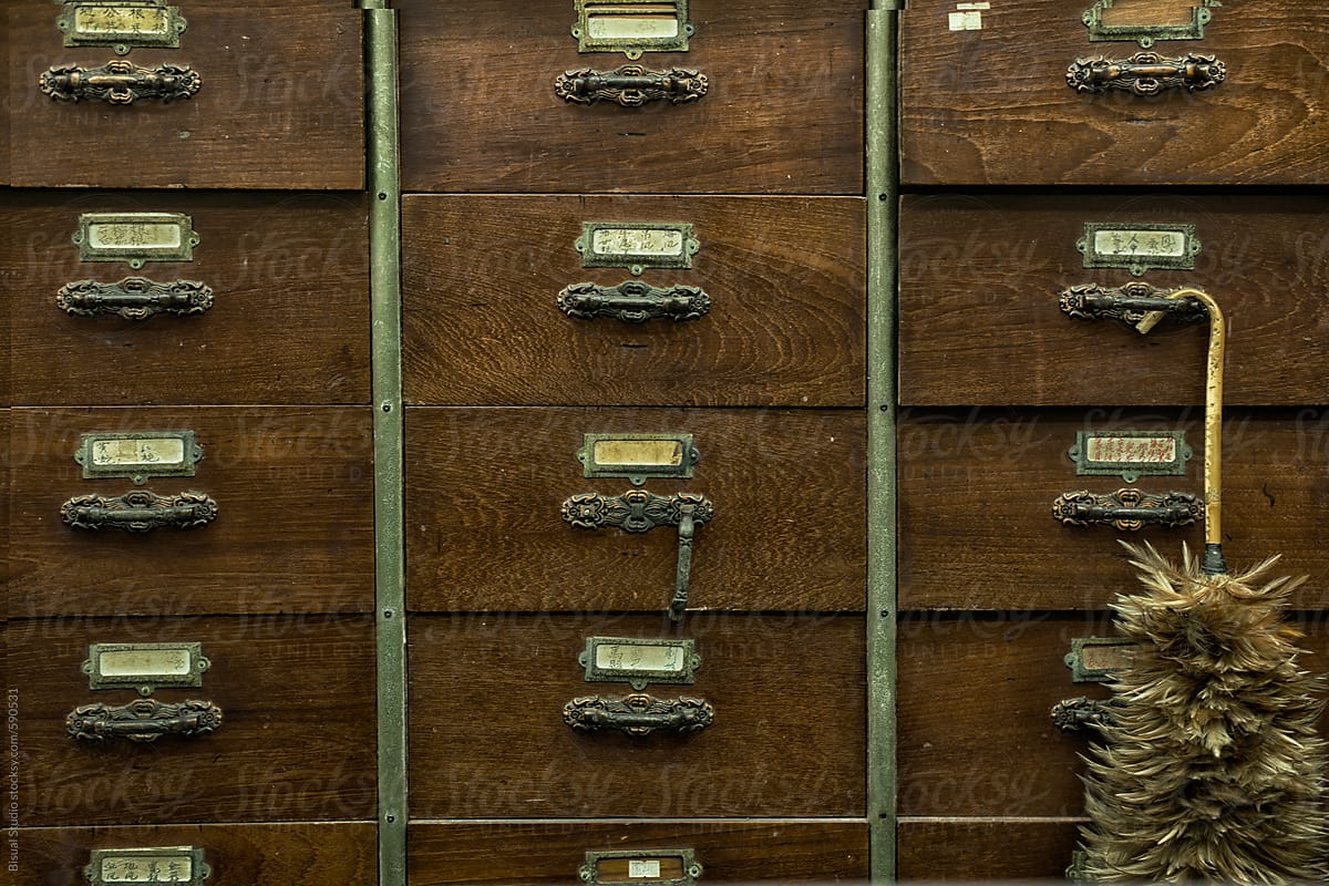Drawers of an apothecary chest with a duster