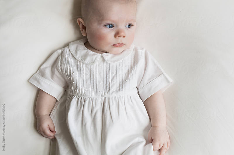 portrait of a baby in white