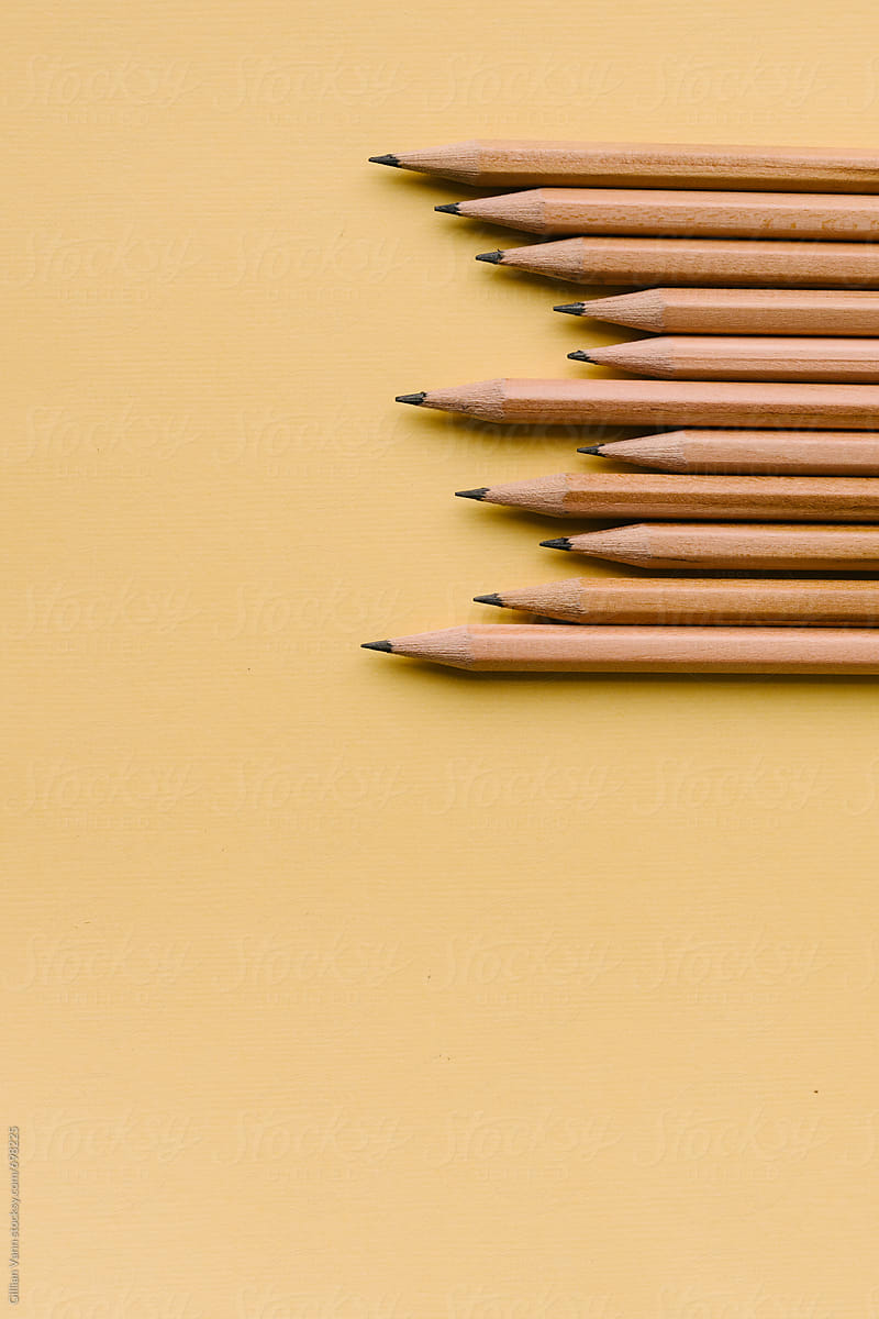 lead pencils on a yellow background, with copyspace