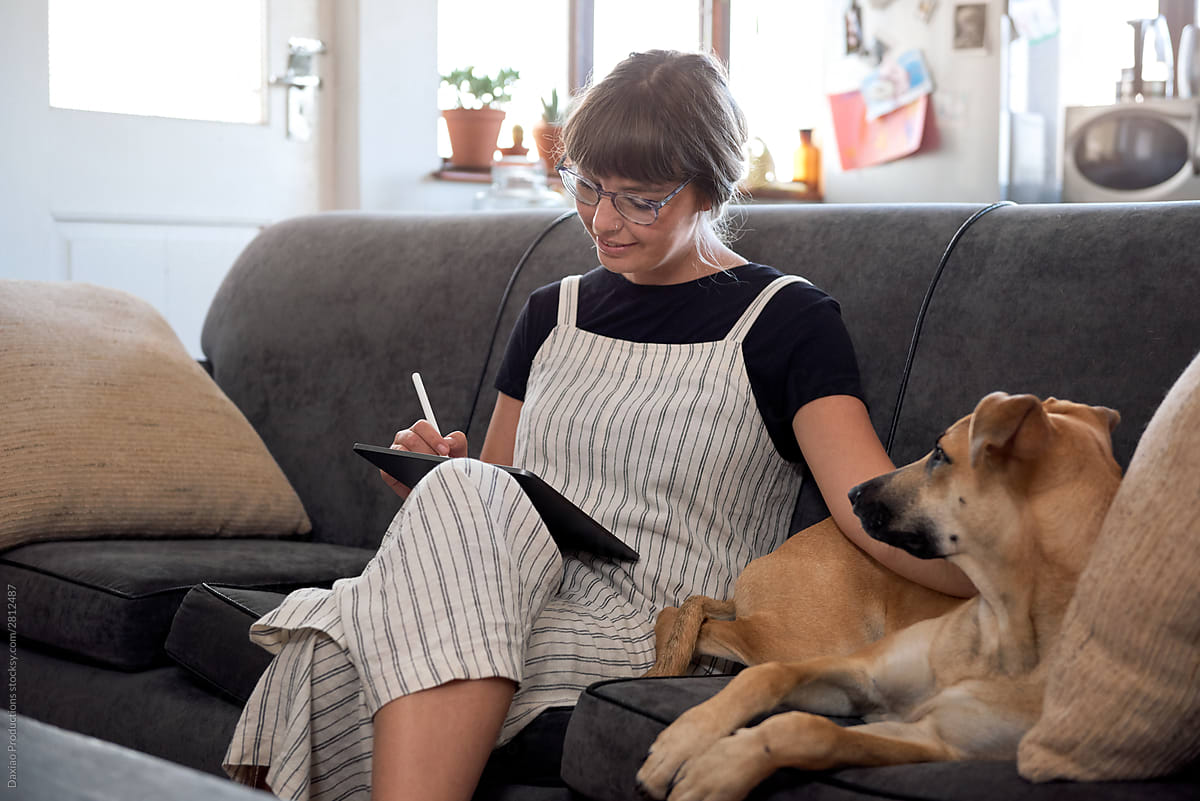 Woman and dog on couch