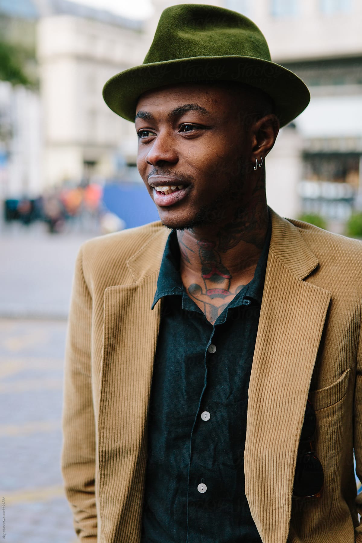 Stylish Young Black Man With Tattoos And Hat by Stocksy