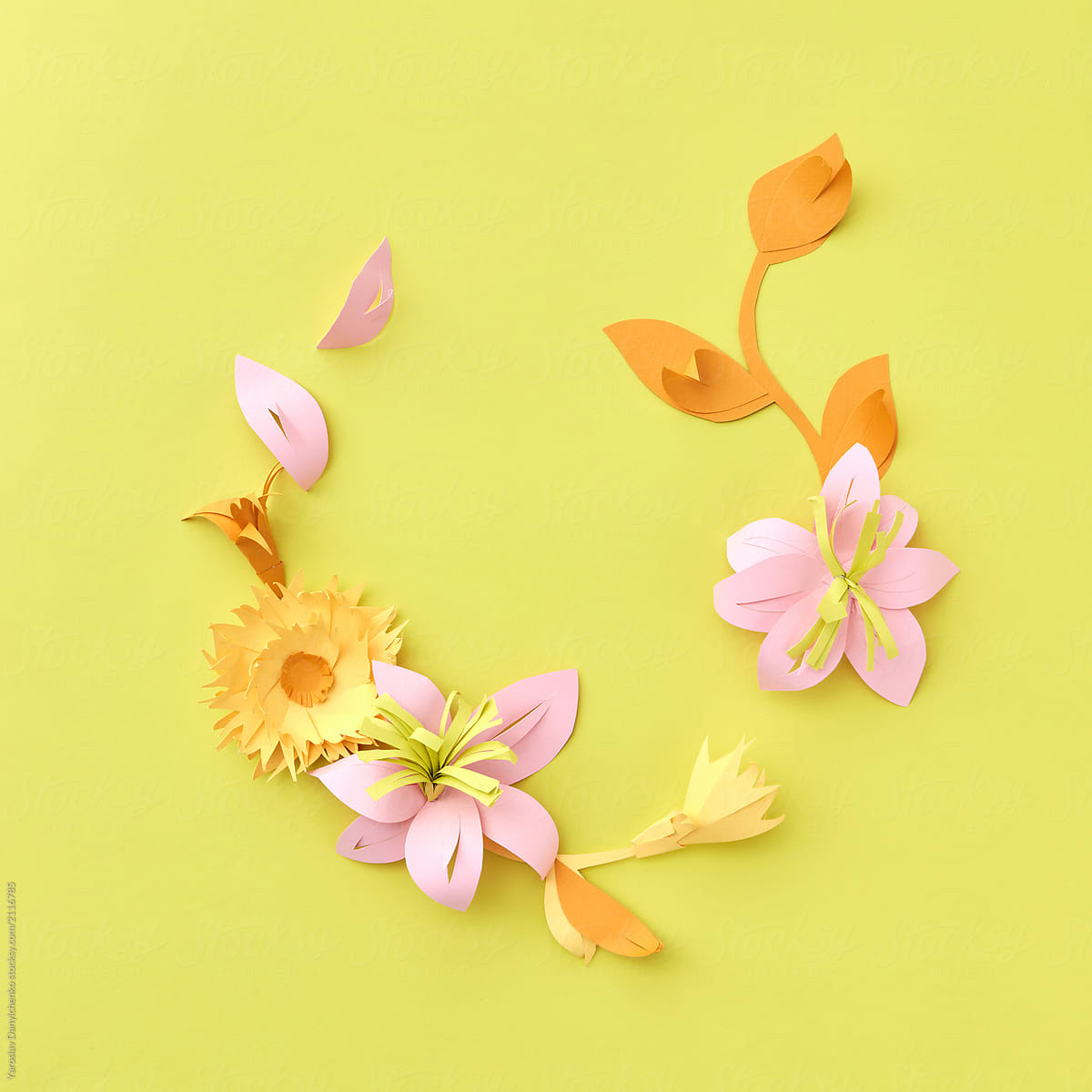 Colofrul handmade paper flowers on yellow background. Paper craf