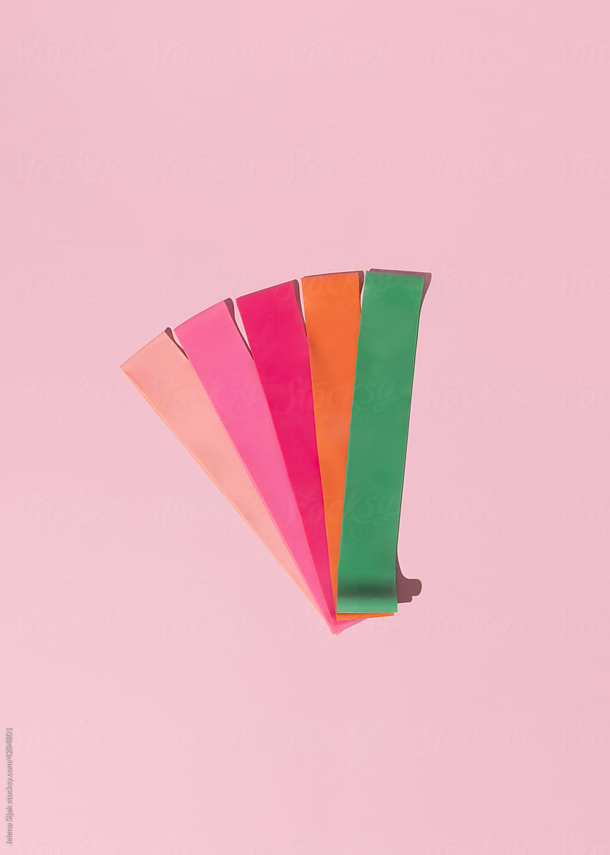 Baby pink, pink, red, orange and green fitness elastic bands.