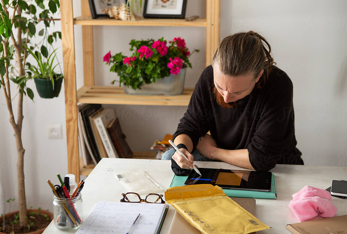 Freelancer at work on a large creative desk