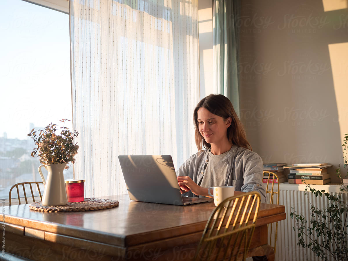 Woman working on laptop from home