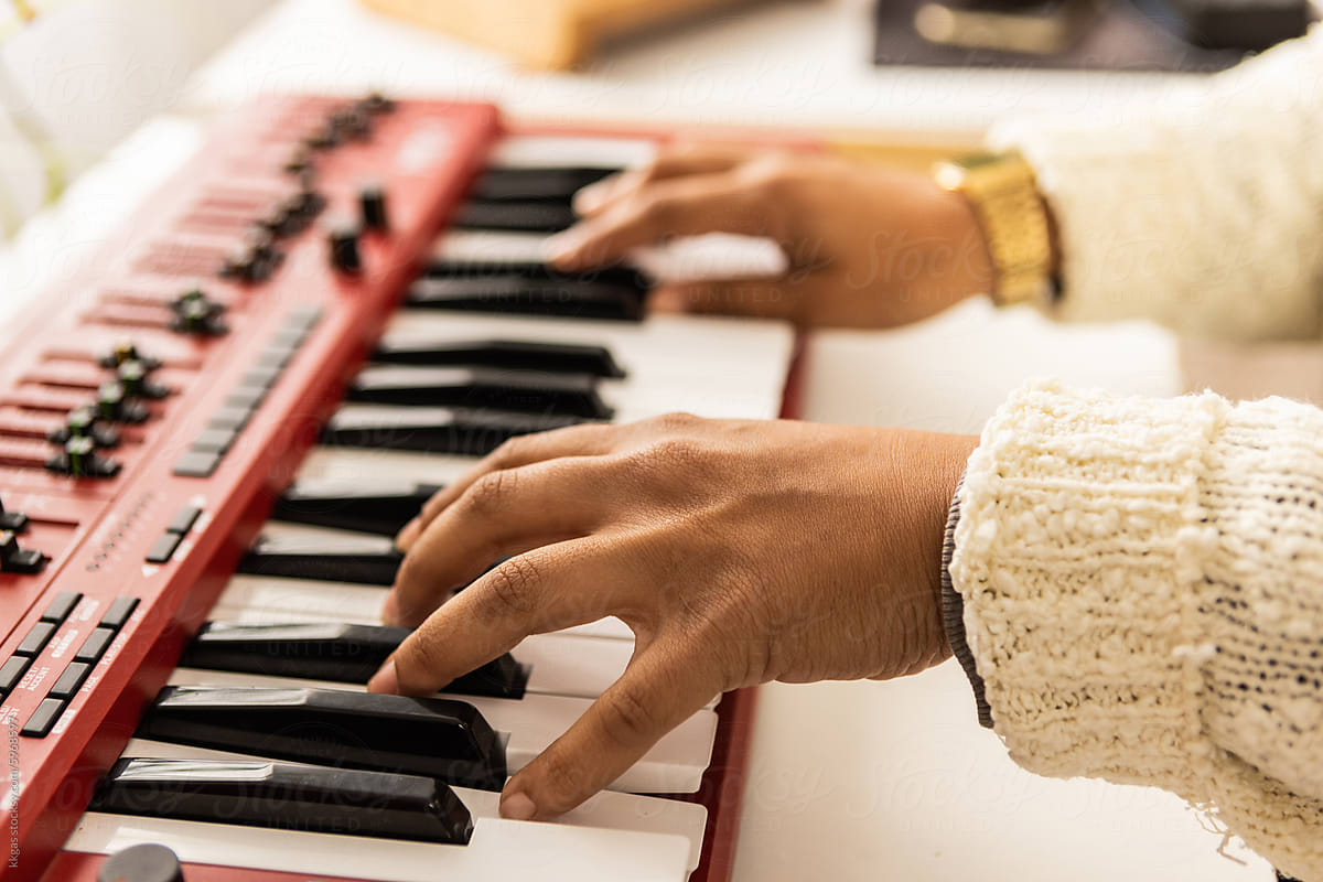 Musician\'s hands playing keyboard