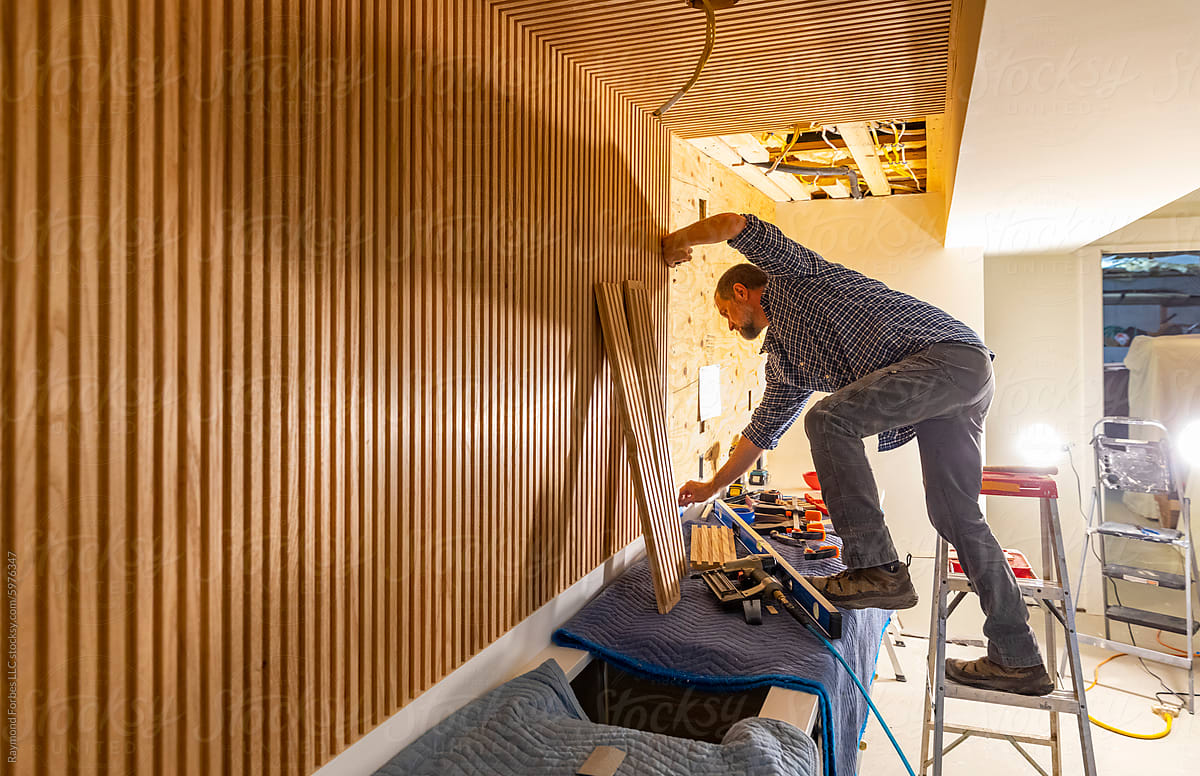 Blue Collar worker Carpenter building Vertical wood paneling wall