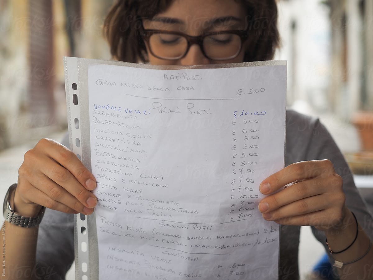 A person reading price list