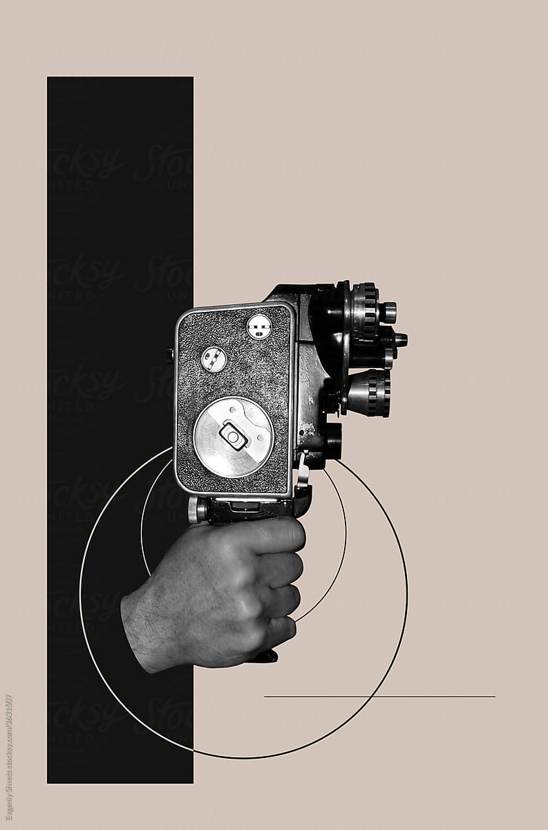 Hand holding old movie camera