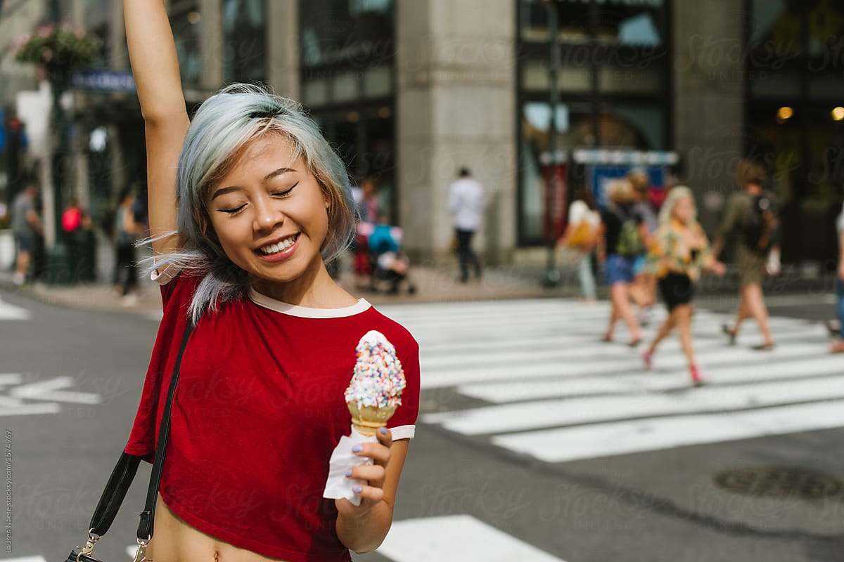 Happy young woman excited about her ice cream cone