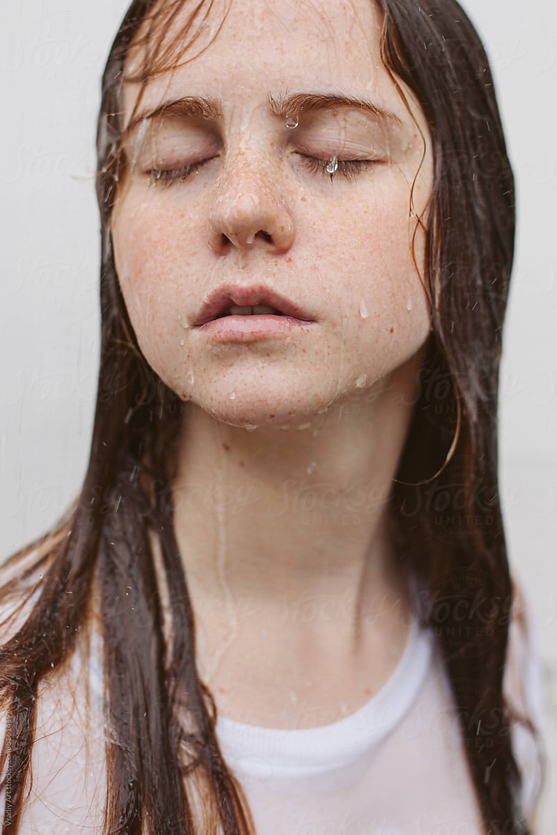 Portrait of woman with drops on her face