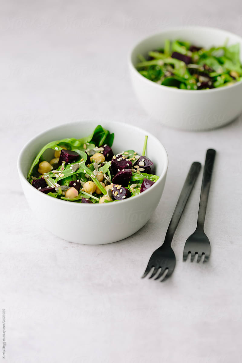 Vegan beetroot salad with spinach, rocket, chickpeas and seeds