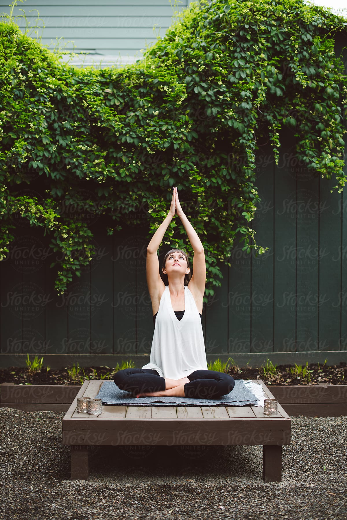 Young Woman Doing Yoga In Meditation Garden by Stocksy Contributor Kate  Ames - Stocksy