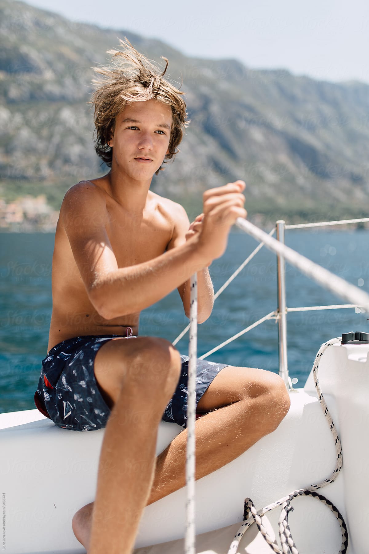 Teenager Preparing Boat For Sailing