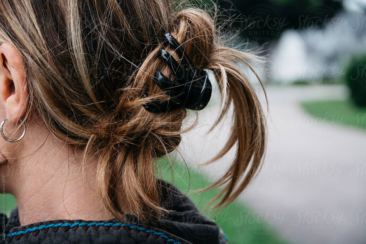 Woman\'s hair held together by a hair clip