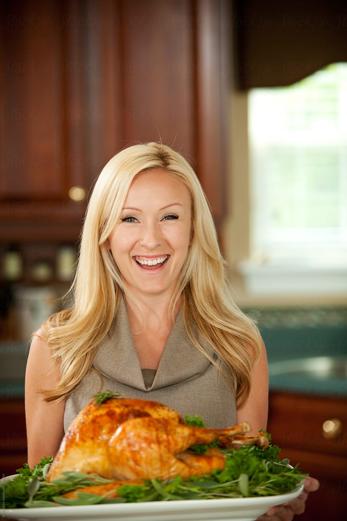 Thanksgiving: Woman Holds Turkey Platter
