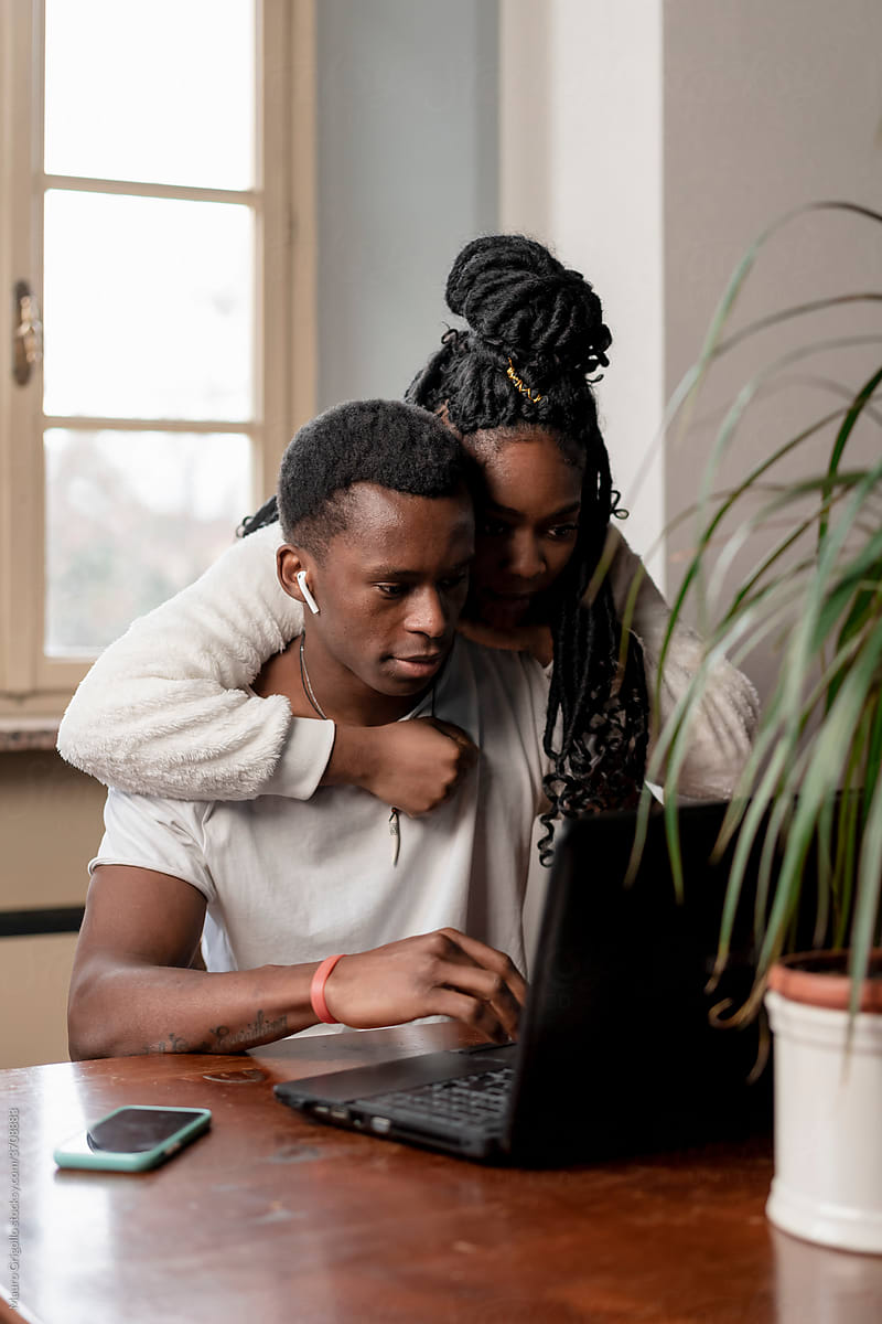 Black Couple using technology At Home