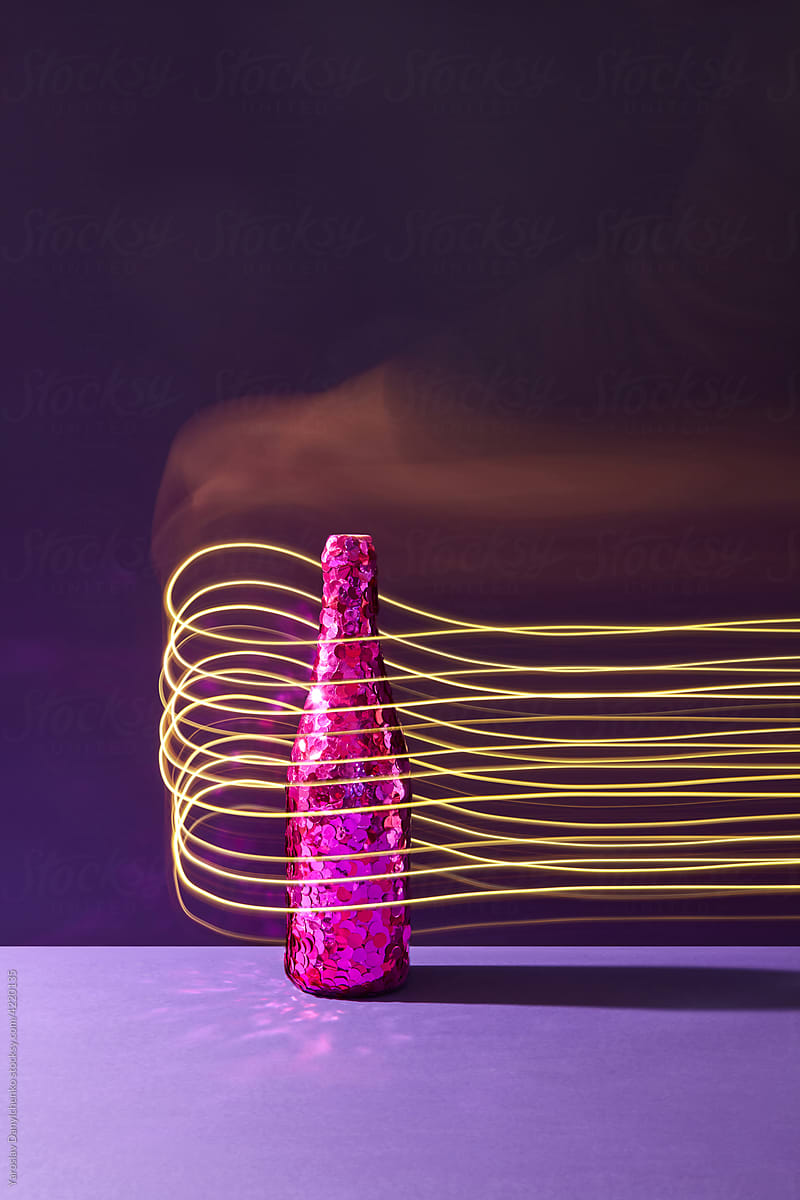 Festive bottle of champagne with light painting