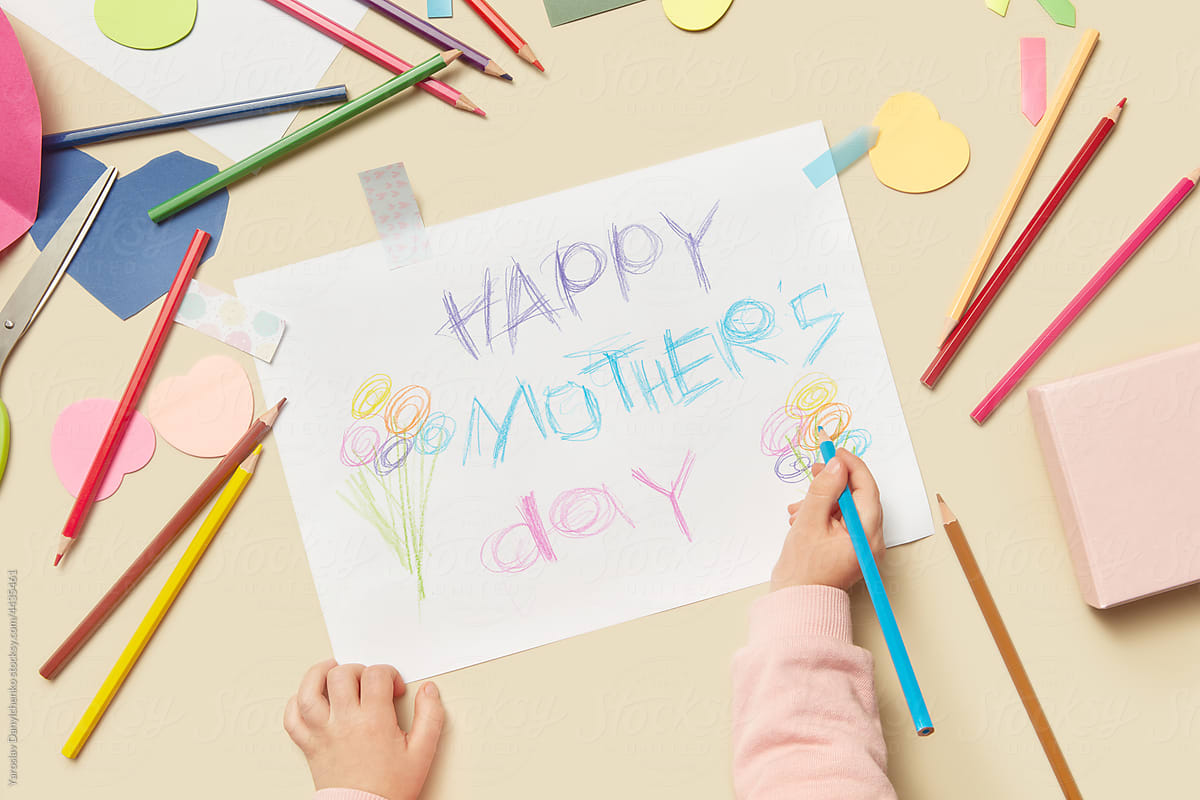 Child making handmade card for mother\'s day