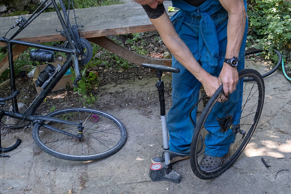 bicycle maintenance repairing a flat tire.