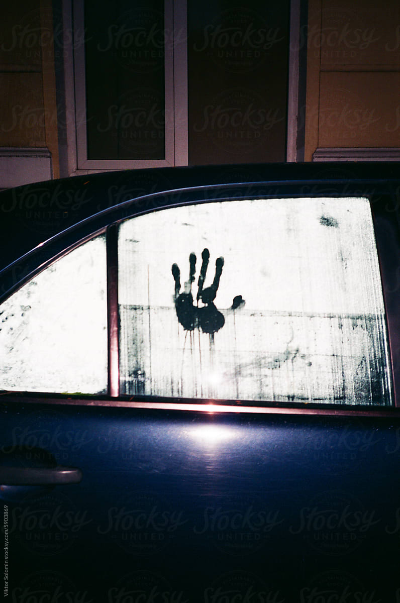 car door with Handprint On Foggy Window