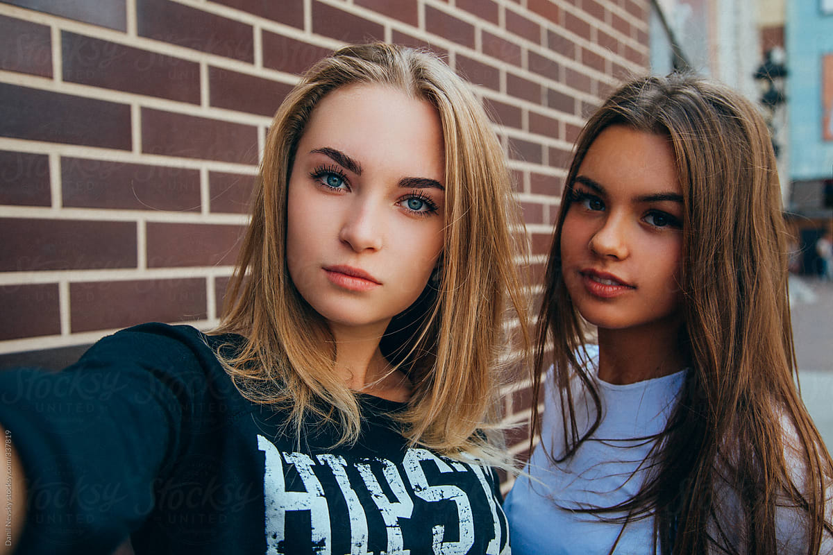  Two  Young Girls Taking  Selfie  Using Smartphone Stocksy 