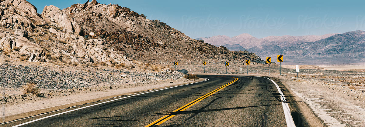 Curve Ahead - Road Through California Desert Landscape