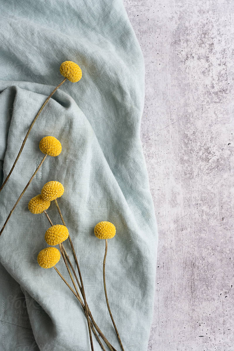 Yellow flowers on blue linen