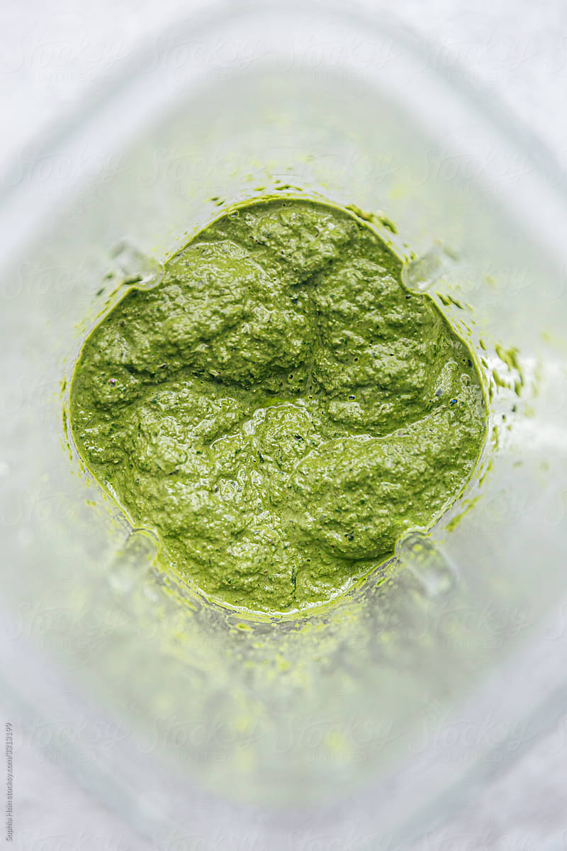 Greens pureeing in a blender