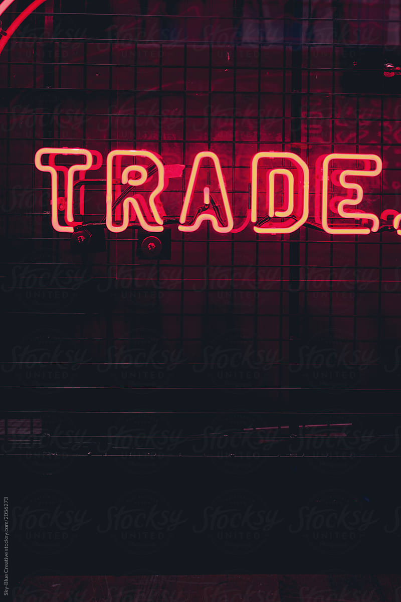 Red neon sign with trade word