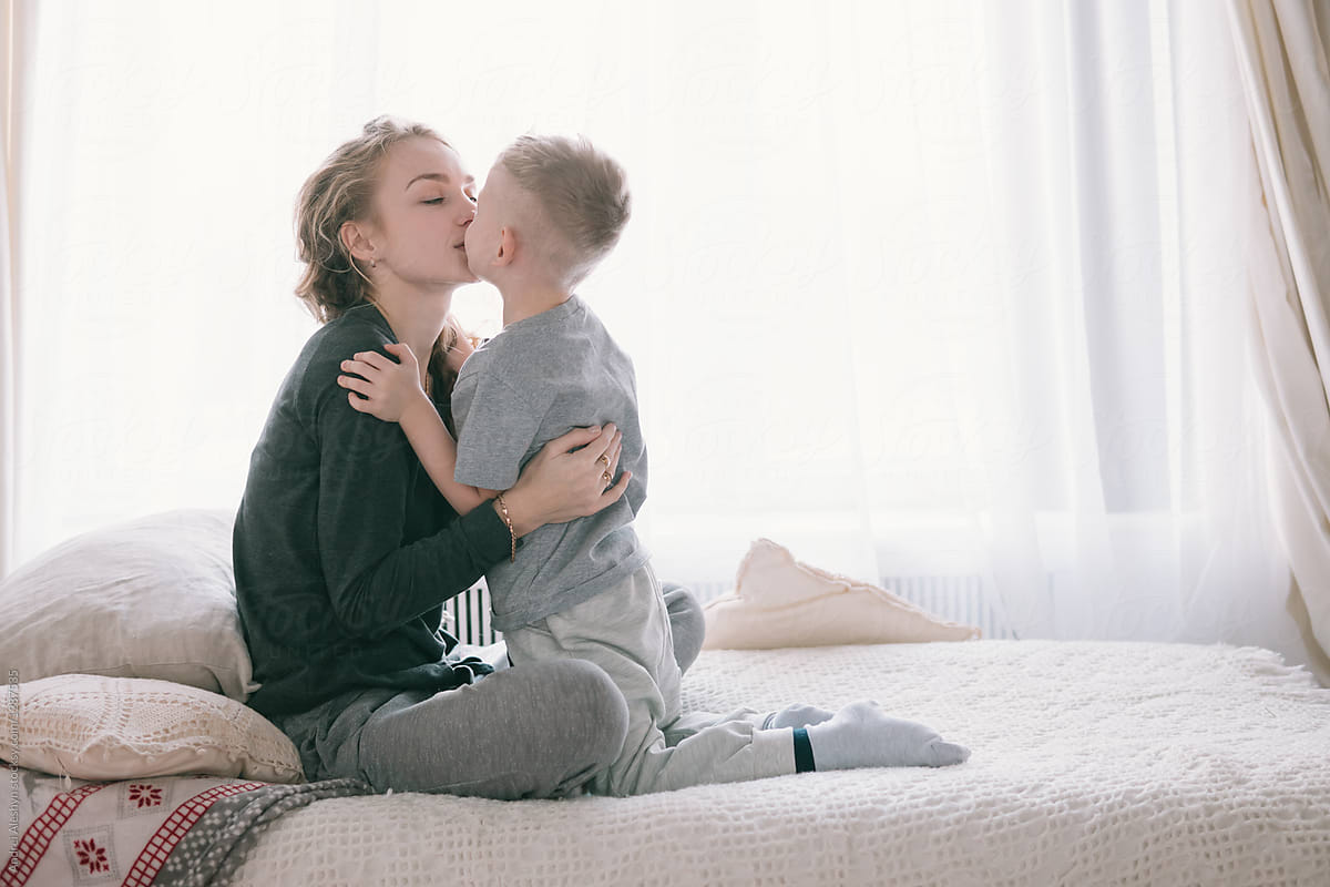 Pretty Beautiful Family Mother And Son In Bed In The Morning by Andrei