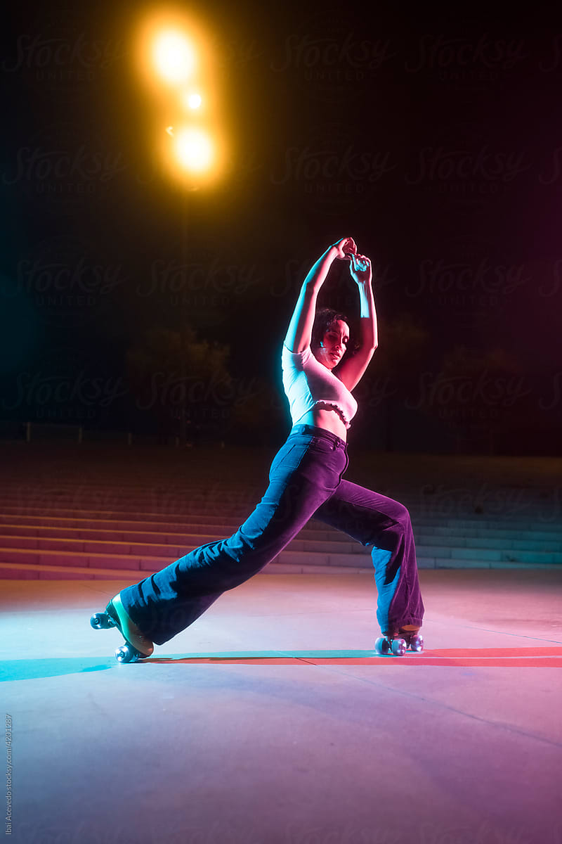 Roller skater woman performing a trick