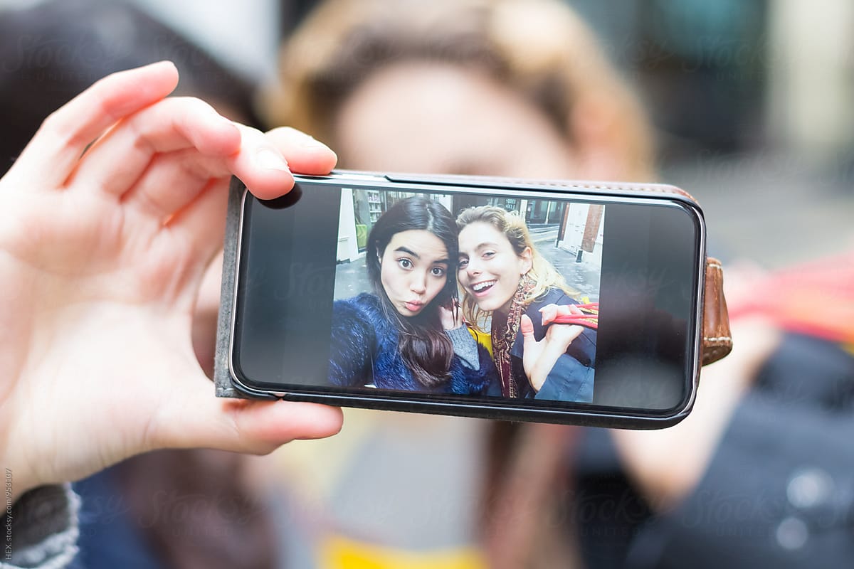 Female Best Friends Taking a Picture with the Phone