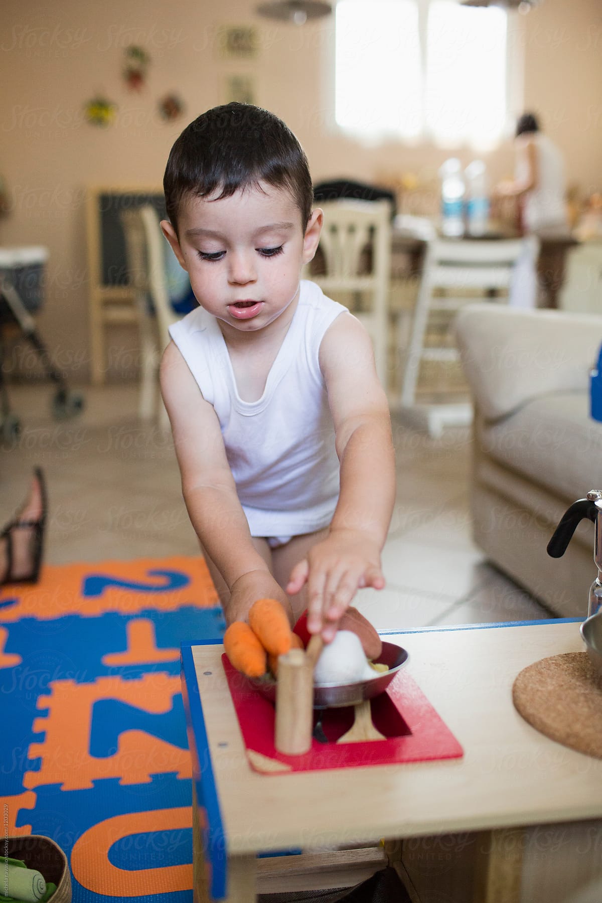 "Little Boy Playing With A Toy Kitchen At Home" by Stocksy Contributor ...