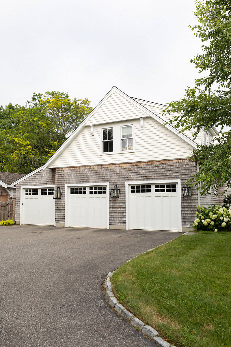 Three car Garage Door Driveway at Contemporary Home outside