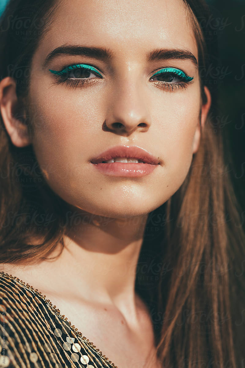 Sunlit Beauty Of A Woman With Turquoise Eyeshadow Del Colaborador De Stocksy Alexandra Bergam 