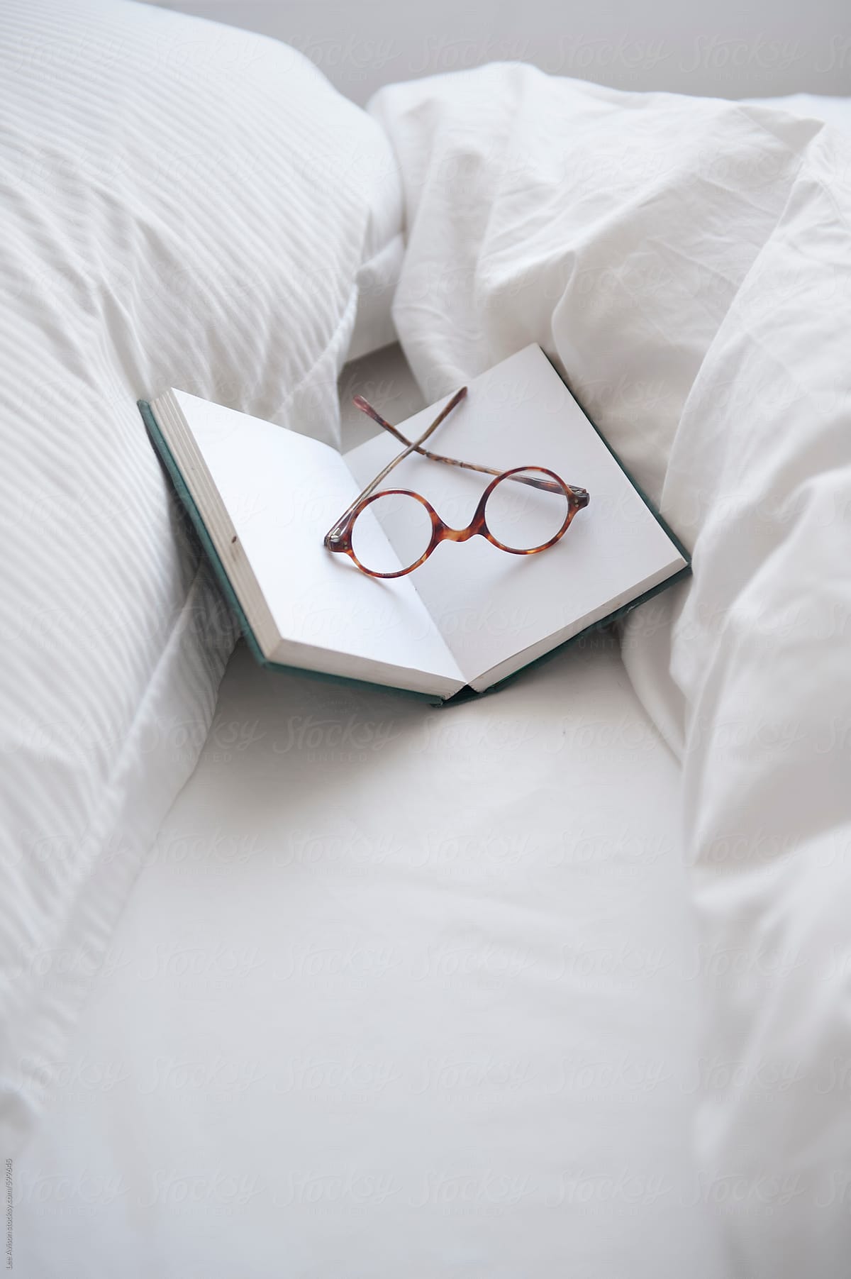 vintage spectacles on an open book