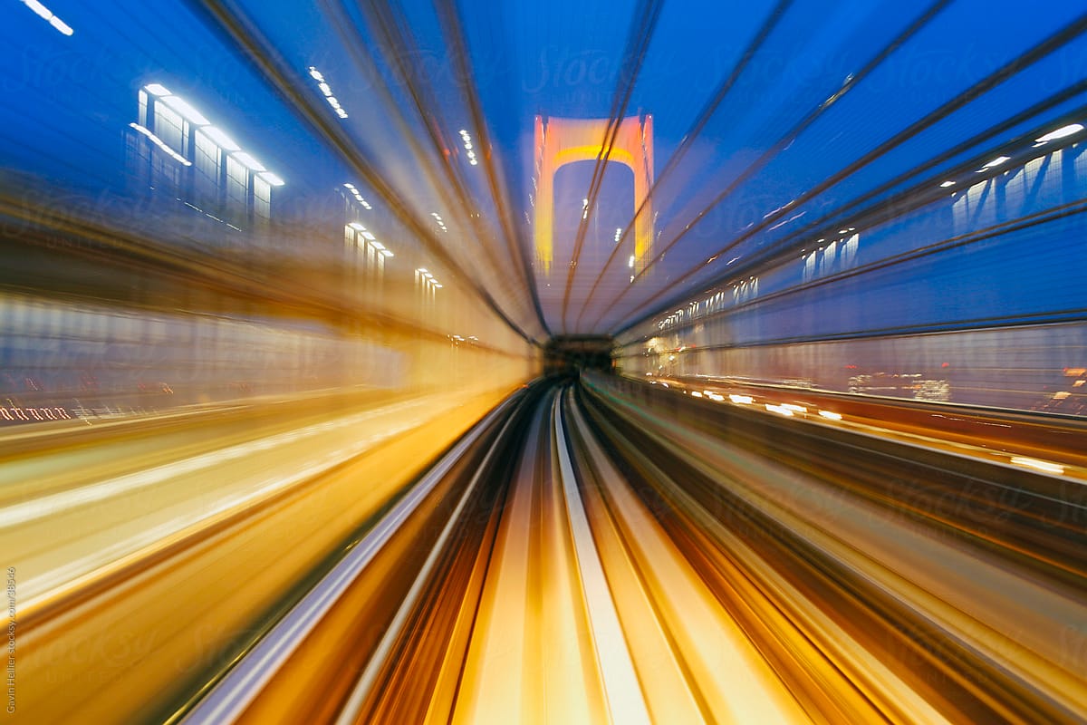 Asia, Japan, Honshu, Tokyo, POV blurred motion from a moving train crossing the Tokyo Bay Rainbow Bridge