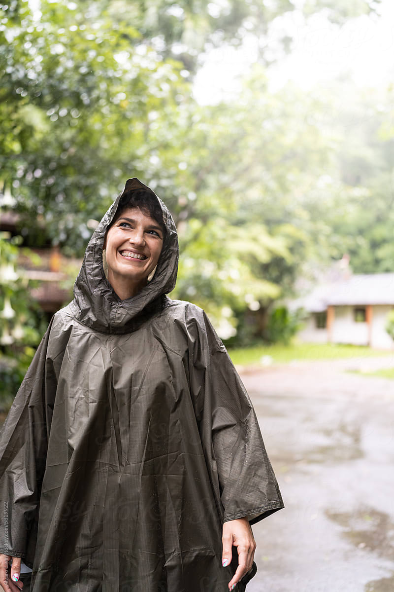 Woman enjoying a rainy day outdoors.