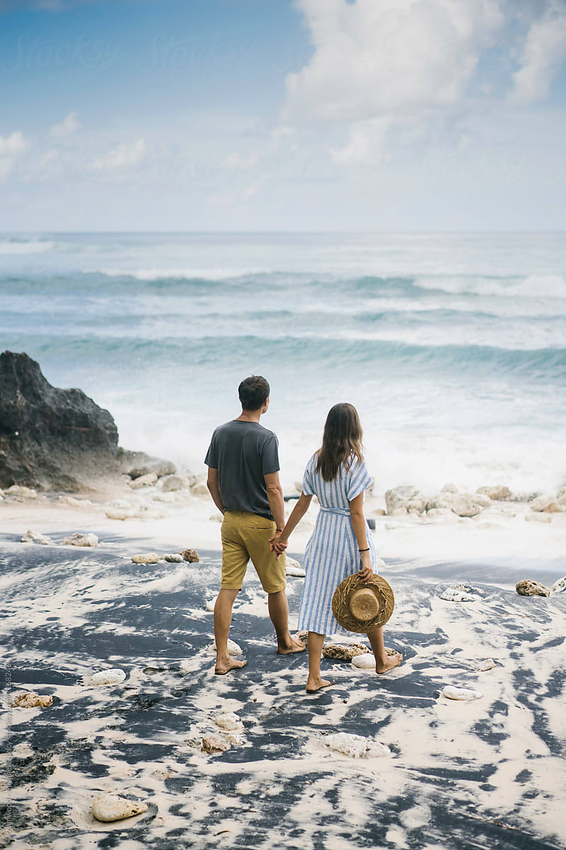 Romantic Couple Holding Hands On Exotic Beach By Stocksy Contributor Dreamwood Photography