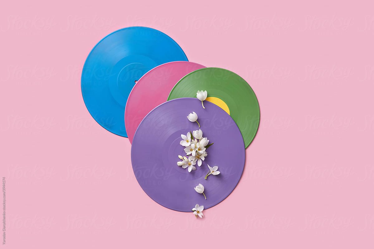 Colored vinyl records with beautiful white flowers