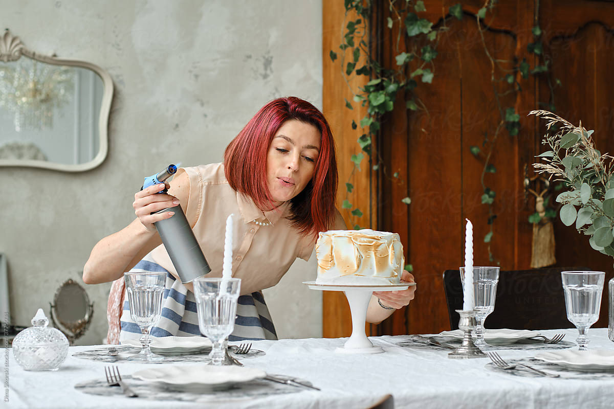a girl prepares a cake
