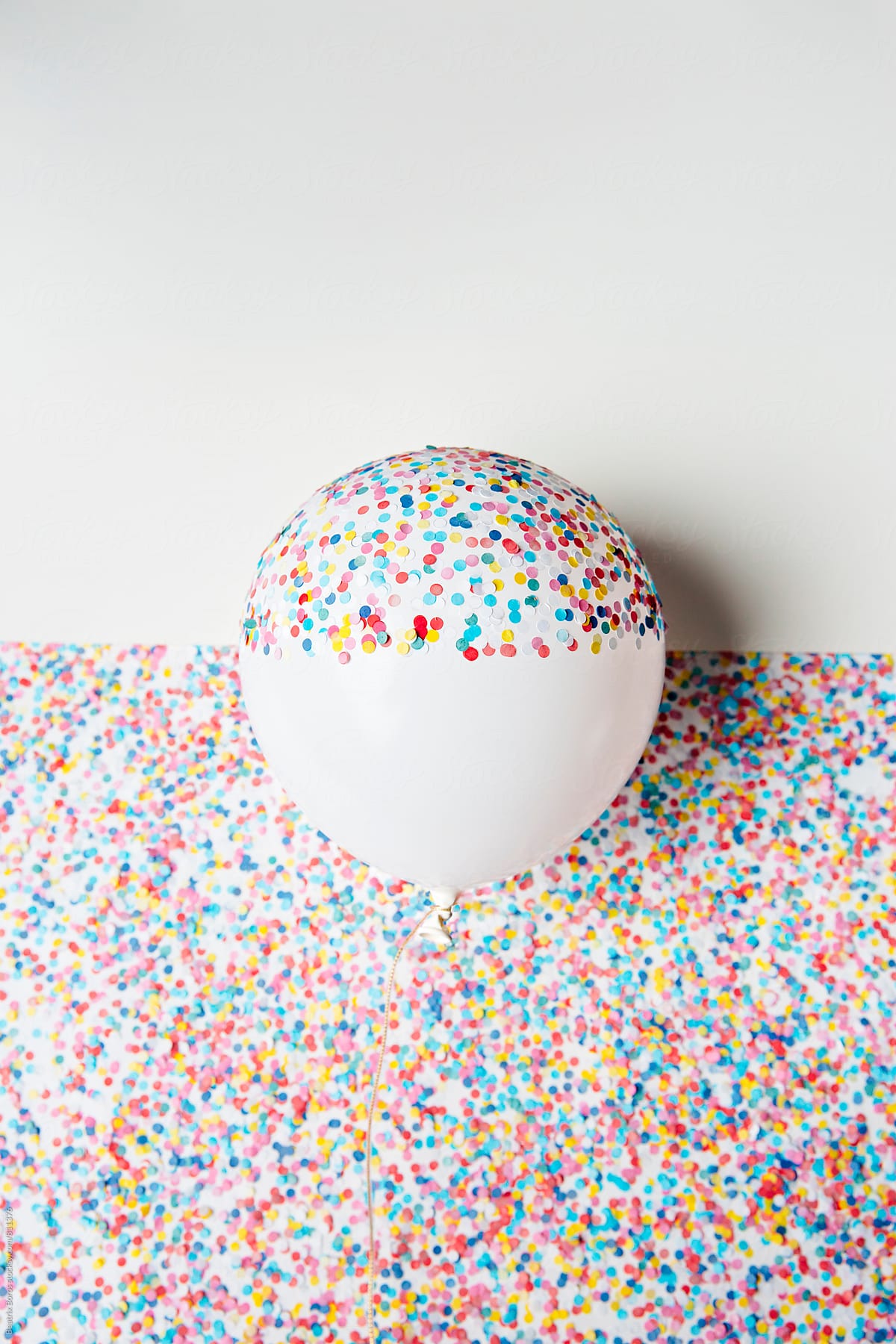 Balloon half covered with confetti