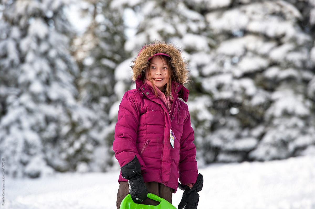Girl With Sled in Snow