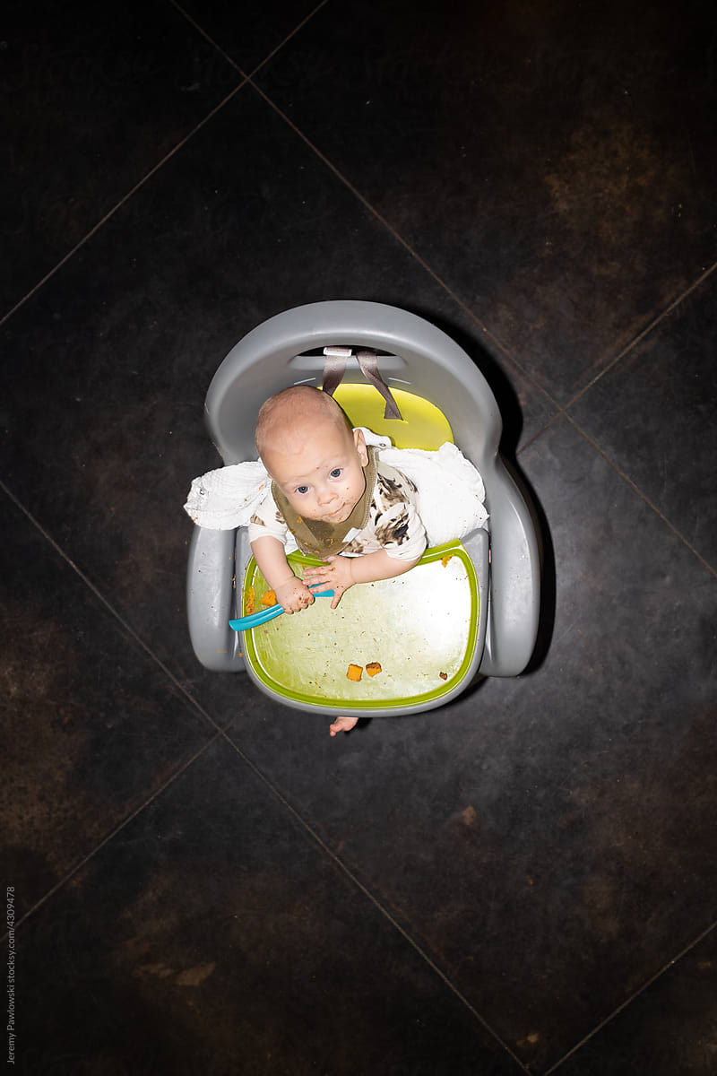 Baby Eating In High Chair