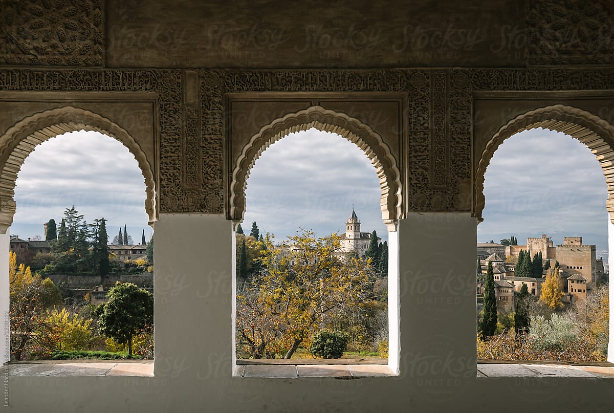 Alhambra seen throgh three arches with arabic design